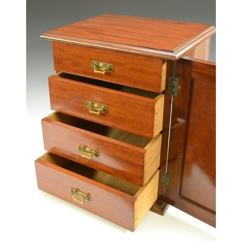 3155 - A Victorian mahogany collector's table cabinet, rectangular moulded top above a panelled door enclos... 