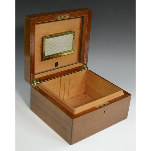 3160 - A walnut cigar humidor, by Dunhill, London, hinged quarter veneered cover, containing a part box of ... 