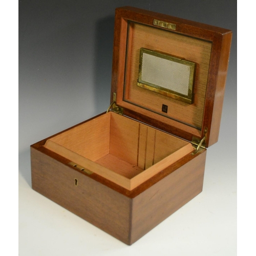 3160 - A walnut cigar humidor, by Dunhill, London, hinged quarter veneered cover, containing a part box of ... 