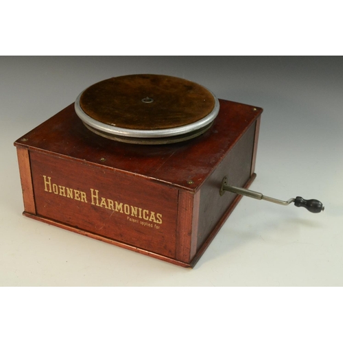 3164 - Advertising - Musical Instruments - an American mechanical shop display turntable stand, Hohner Harm... 