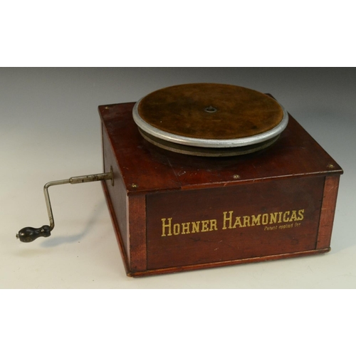 3164 - Advertising - Musical Instruments - an American mechanical shop display turntable stand, Hohner Harm... 