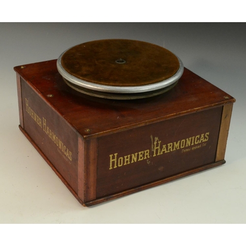 3164 - Advertising - Musical Instruments - an American mechanical shop display turntable stand, Hohner Harm... 