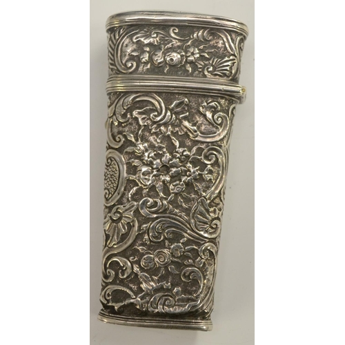 3168 - An 18th century silver-coloured metal tapered rectangular etui, chased overall in the Rococo taste w... 