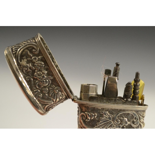 3168 - An 18th century silver-coloured metal tapered rectangular etui, chased overall in the Rococo taste w... 