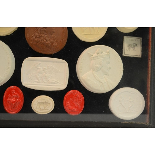 3171 - An arrangement of plaster intaglios, various Classical Grand Tour subjects, mounted in a tooled moro... 