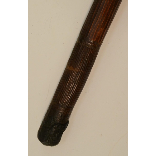 3805 - Tribal Art - an Australian Aboriginal nulla nulla or waddy club, carved with ridges and a textured g... 