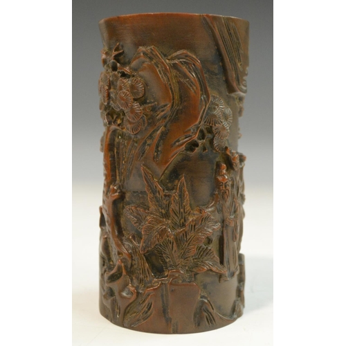 3068 - A Chinese hardwood bitong brush pot, carved in relief with figures and prunus trees in a monumental ... 