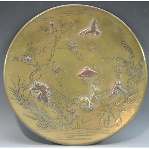 3100 - A Japanese bronze and mixed metal circular charger, chased and applied with boys busy on the river, ... 