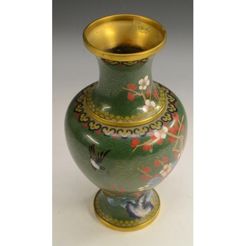 3102 - A Japanese cloisonné vase, enamelled with peonies and other foliage on a green ground, 23.5cm high, ... 