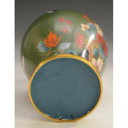 3102 - A Japanese cloisonné vase, enamelled with peonies and other foliage on a green ground, 23.5cm high, ... 