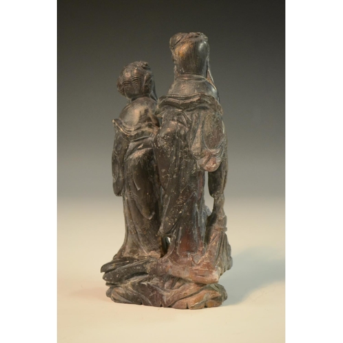 3067 - A Chinese grey soapstone carving, of two female deities, each holding their respective attributes an... 