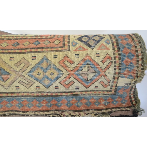 3122 - A Middle Eastern rectangular woollen carpet, the runner with a field of twenty-four geometric guls, ... 