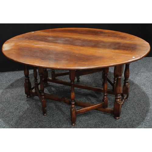 261 - A large oak wake table, in the 18th century Irish manner, possibly by Titchmarsh & Goodwin