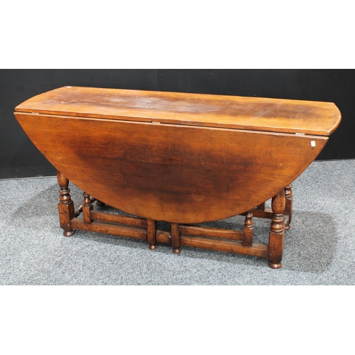 261 - A large oak wake table, in the 18th century Irish manner, possibly by Titchmarsh & Goodwin