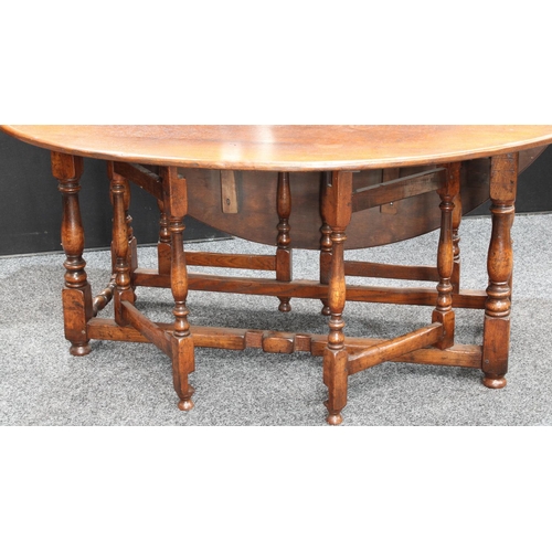 261 - A large oak wake table, in the 18th century Irish manner, possibly by Titchmarsh & Goodwin