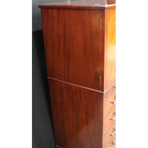 263 - A flame mahogany tall boy, with a pair of doors above a slide and four long drawers, possibly Maple ... 