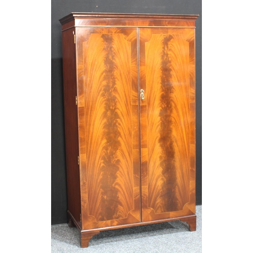 264 - A flame mahogany double wardrobe, by Maple & Co