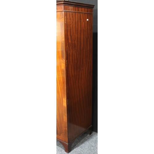 264 - A flame mahogany double wardrobe, by Maple & Co