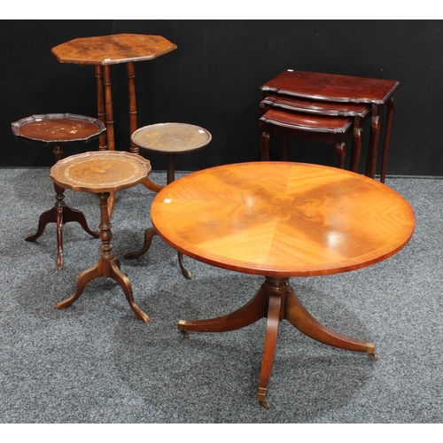 266 - A Regency style low circular occasiontal table; three similar wine tables; an octagonal triple-colum... 