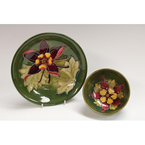 278 - A Moorcroft Clematis pattern bowl, 11cm diam. impressed mark; a similar plate, 18.5cm (2)