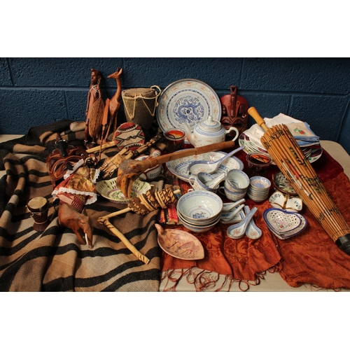 465 - A Chinese style parasol; a Chinese teapot, bowls, cups, spoons set; napkins; African souvenir tribal... 