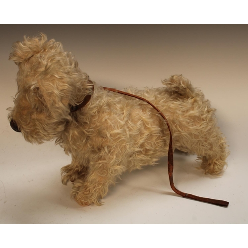 485 - A 1940s Chiltern Toys Stuffed soft Terrier dog,  modelled standing, legs stretching fore and aft, cr... 