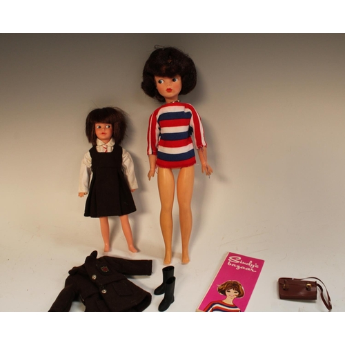 490 - Dolls -  an early 1960s Sindy Bazaar doll, brown hair, blue eyes, striped red white and blue blouse,... 