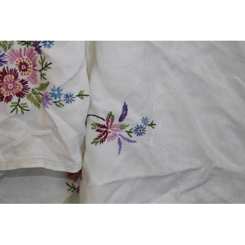 492 - Textiles - hand embroidered floral and lace edged linen tablecloths