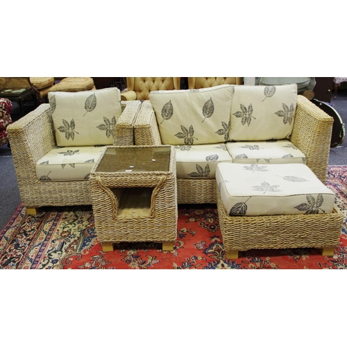 327 - A woven rattan conservatory suite comprising two seat sofa, armchair, pouffe and table. (4)