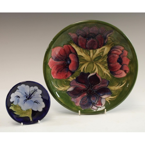 5019 - A Moorcroft Anemone pattern plate, 26cm diameter; an Anemone pattern circular dish, 11.5cm; an Hibis... 