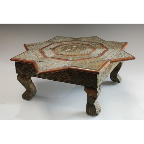 5048 - An Indian embossed metal mounted Bajot/opium tea table, 18cm high, 50cm wide, 19th/early 20th centur... 