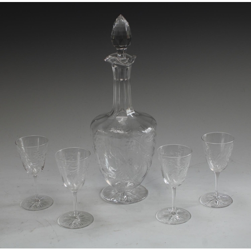 5069 - A clear glass liqueur decanter finely engraved with fanciful birds perched amongst foliage, faceted ... 