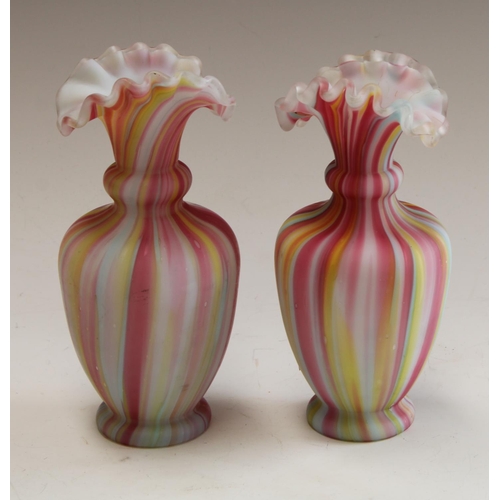 5070 - A pair of ovoid cased glass rainbow vases, fluted everted rims, 17.5cm