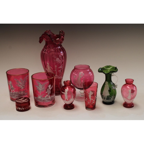 5121 - A pair of Victorian Mary Gregory cranberry tapering cylindrical beakers, enamelled in white with a b... 