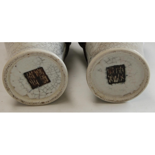 5122 - A pair of 20th century Chinese crackle glazed baluster vases, in relief in brown with scrolling drag... 