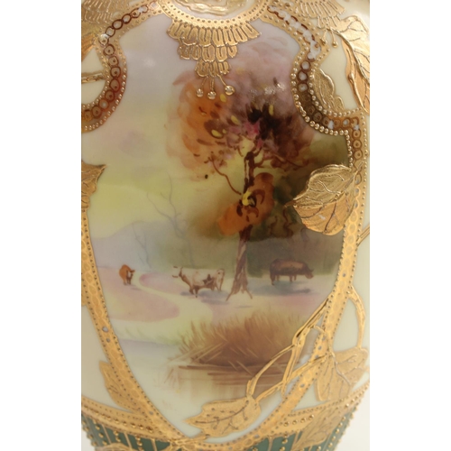 5126 - A pair of Noritake ovoid two handled vases, decorated with shield shped cartouches iwth cattle, the ... 