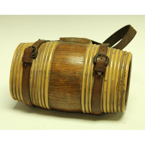 5307 - An early 20th century liquor costrel, of typical staved barrel form, leather suspension strap, 20.5c... 