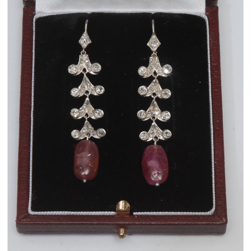 1004 - A pair of diamond and ruby drop earrings, each with a large irregular ruby bead terminal 6.8ct and 6... 