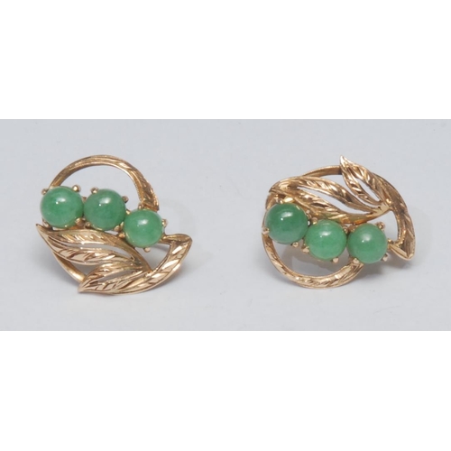 1008 - A pair of screw back leaf earrings, inset with three green stone round cabochons possibly jade, 14ct... 