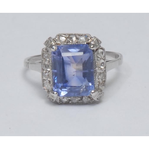 1020 - A sapphire and diamond ring, large rectangular cushion cut purpley blue sapphire, approx 1.95ct, sur... 