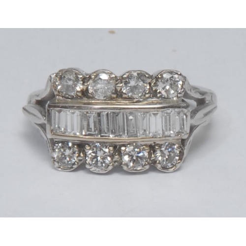 1021 - A diamond cluster ring, central row of ten rectangular and trapezoid baguette cut diamonds, flanked ... 