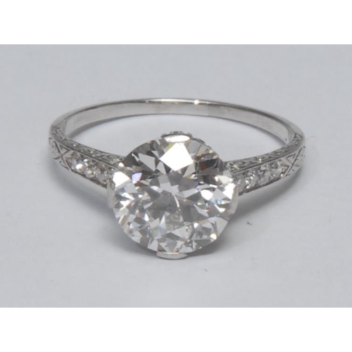 1026 - An impressive diamond solitaire ring, round brilliant cut diamond approx 3.09ct, quarter claw diamon... 