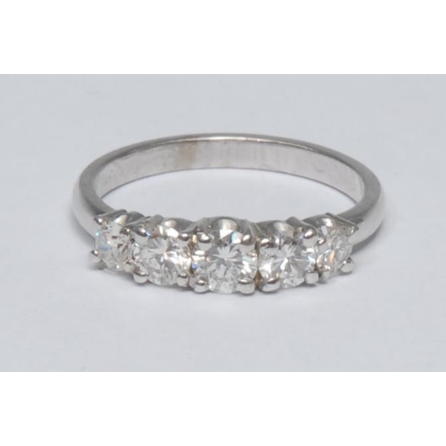 1027 - A quintet diamond ring, liner set with five graduated round brilliant cut diamond, central largest d... 