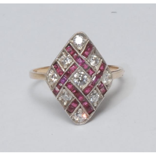 1030 - A diamond and ruby lattice top dress ring, woven diamond shaped crest inset with nine round brillian... 