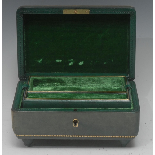 1097 - An early 20th century green tooled leather musical jewellery box, embossed hinged cover, fitted inte... 