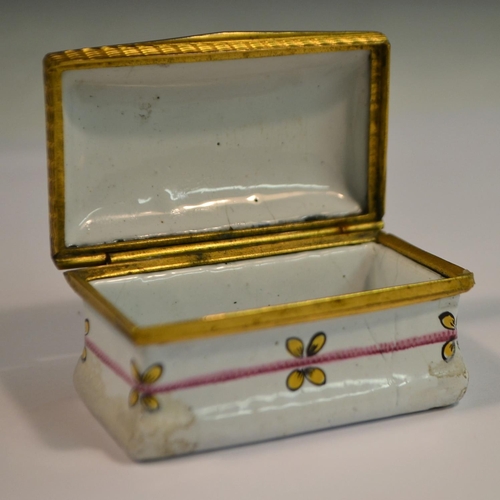 1117 - A George III South Staffordshire enamel rectangular snuff box, the hinged cover printed and picked o... 