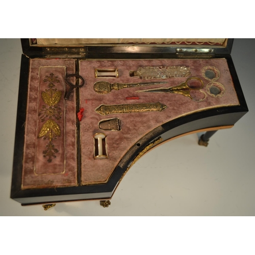 1126 - An early 19th century French ebonised piano sewing etui, the keys in mother-of-pearl, the interior w... 