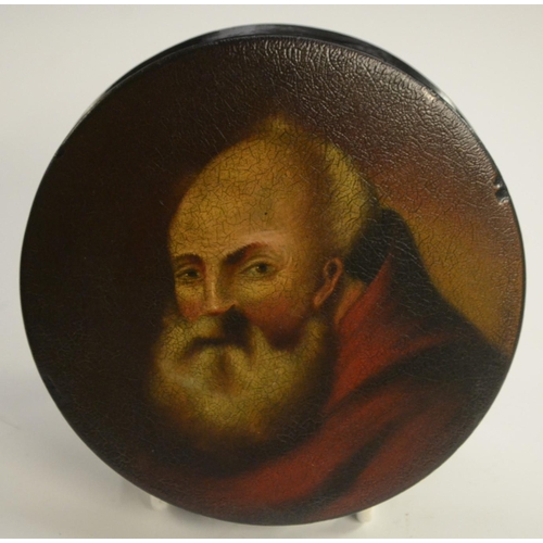 1134 - A 19th century papier-mâché circular table-top snuff box, the push-cover painted with a portrait pro... 