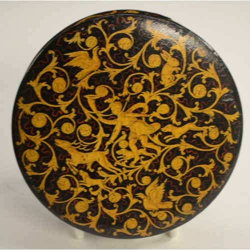 1135 - A 19th century Renaissance Revival black papier-mâché circular table-top snuff box, painted in gilt ... 