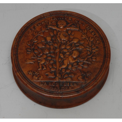 1143 - A late 18th century French burr maple and tortoiseshell circular snuff box, the titled cover pressed... 